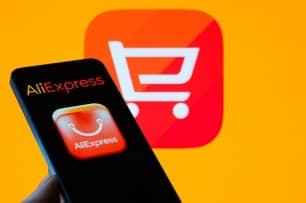A smartphone displays the AliExpress app icon against the platform's logo.