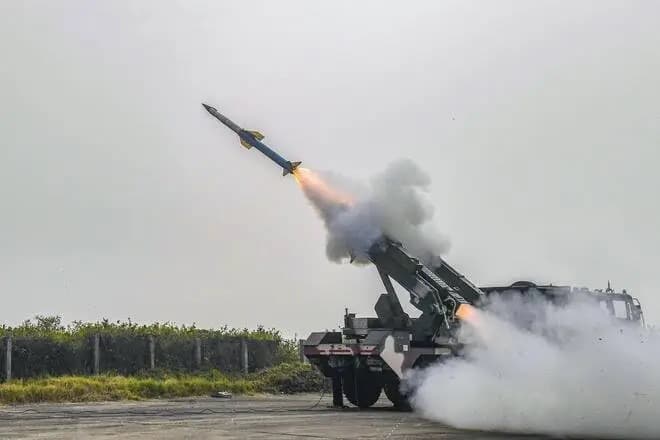 An air defense missile launches from a truck mounted system, a symbol of military technology.