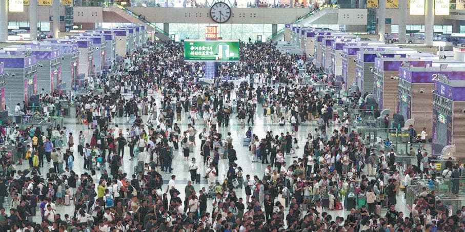 Passengers wait in the concourse at Zhengzhou East Railway Station.