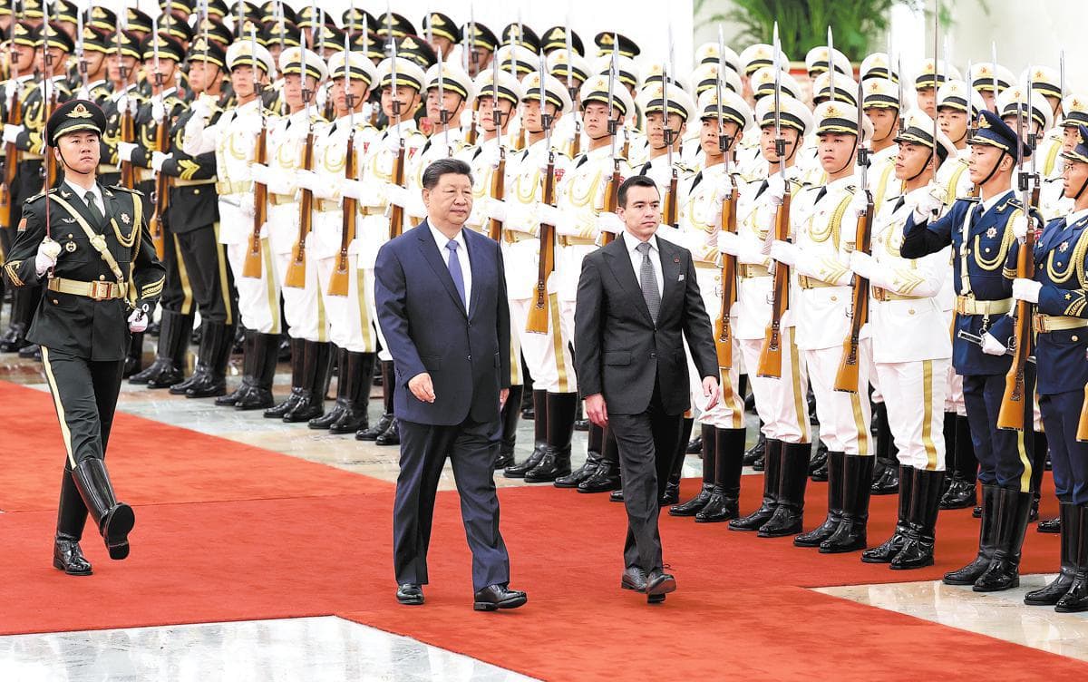 President Xi Jinping and Ecuadorian President Daniel Noboa review an honor guard outside the Great Hall of the People in Beijing.